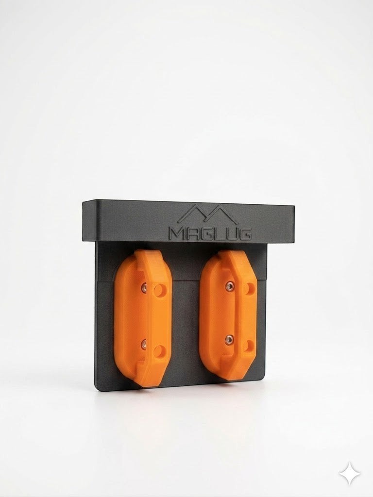 Cold Composites MagLug Magnetic Workstation in black with two orange magnetic handles, made of carbon fiber reinforced composite.
